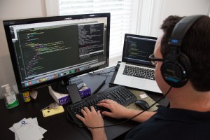 Developer working on code at computer