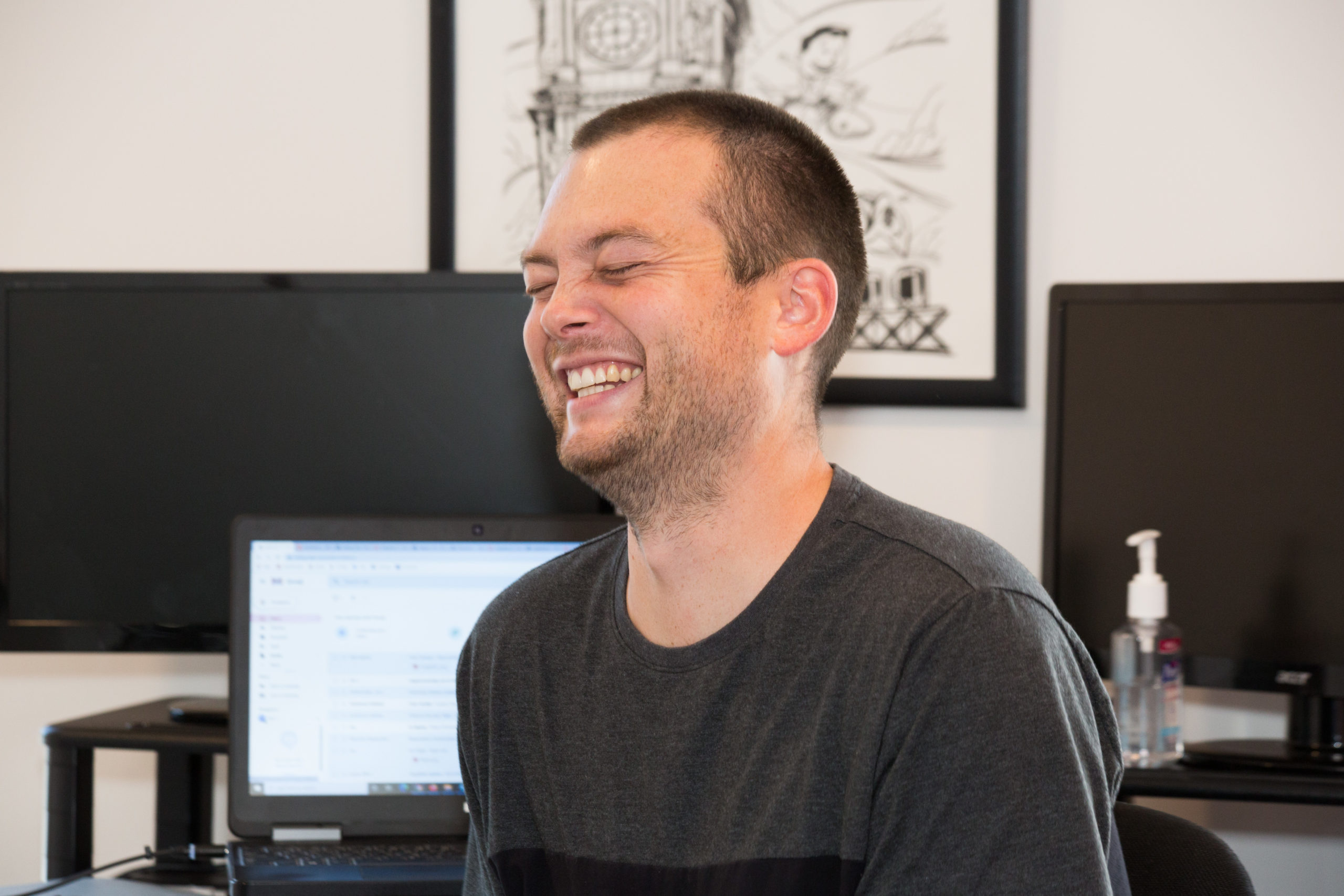 close up of man laughing at work