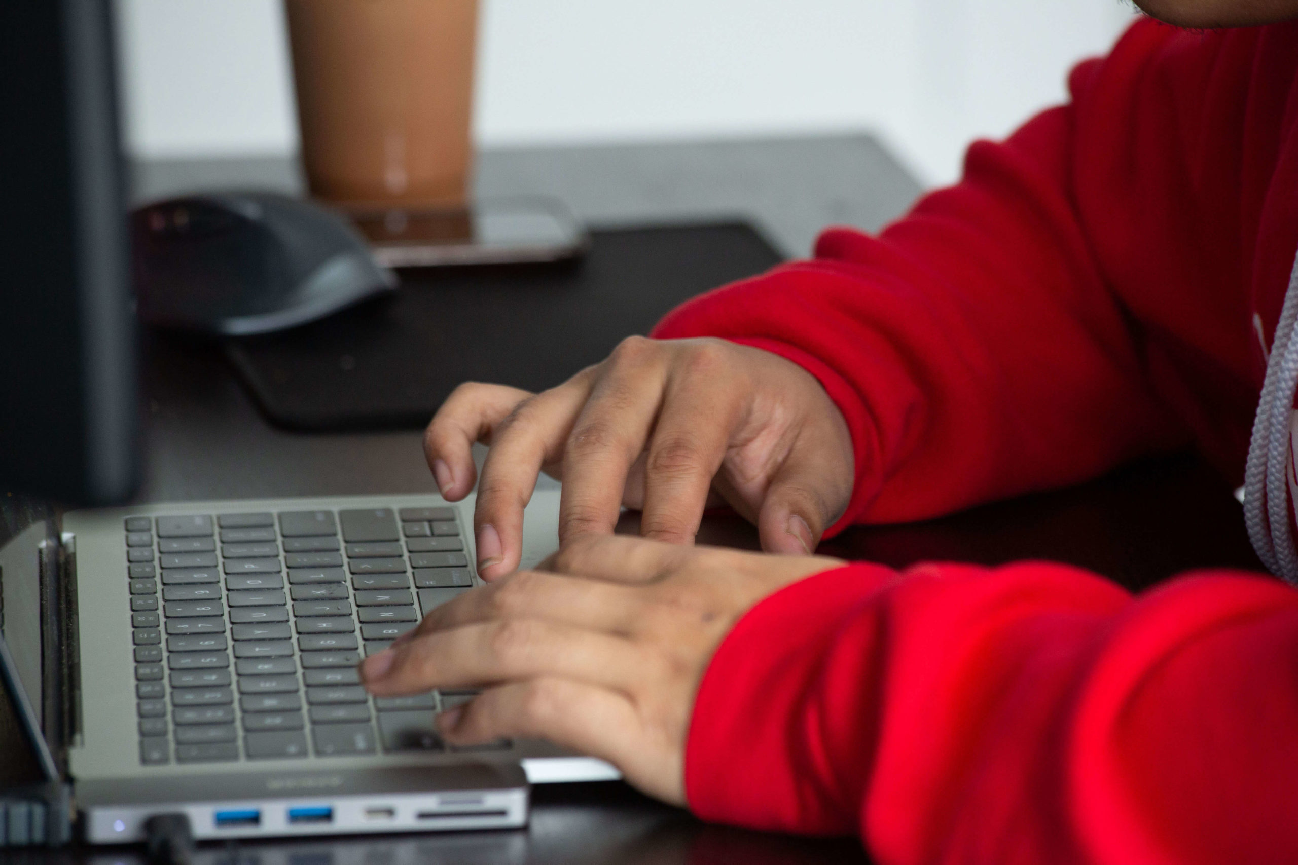 close up of hands on a laptop