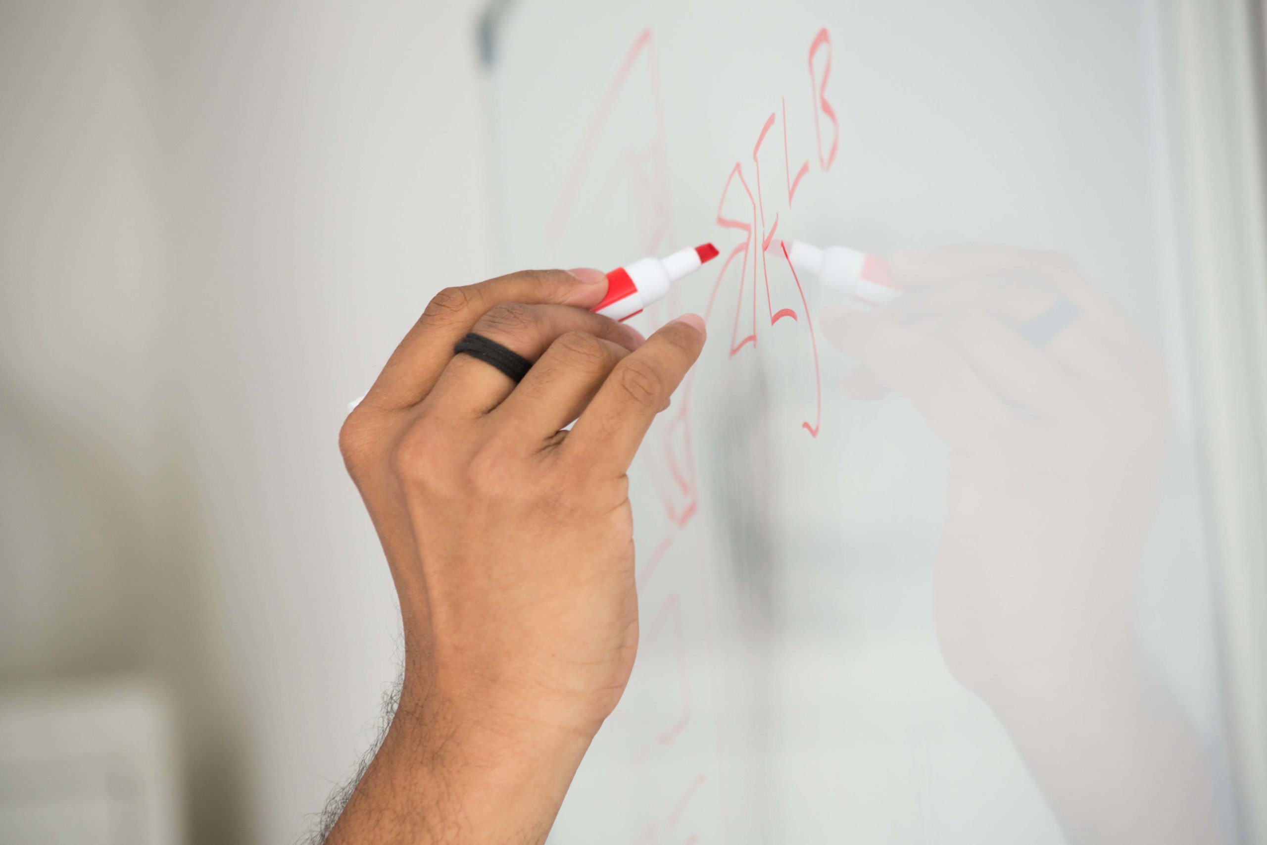 close of of hand writing on a white board