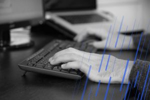close up of hands on a keyboard