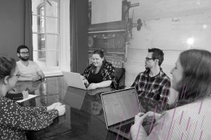 employees gathered around a conference table