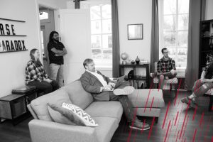 employees socializing in office living room