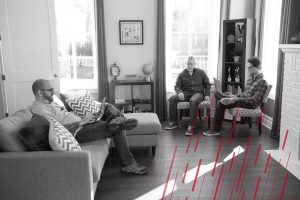 three men working in an office