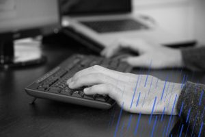 close up of hands on a keyboard